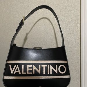 NWT Mario Valentino shoulder/mini bag. Super cute and trendy.